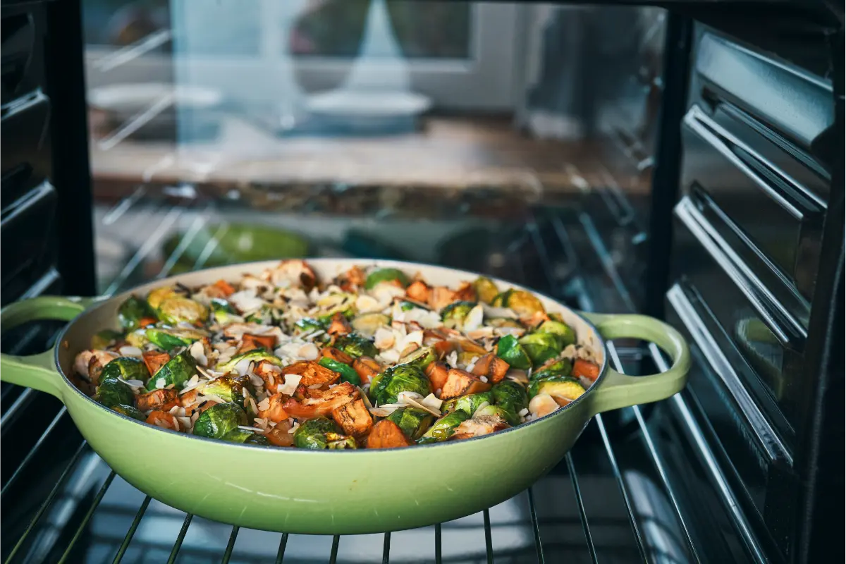 An oven-baked "Ultimate Chicken Casserole" in a green pan, blending chicken and vegetables for a robust and comforting meal.